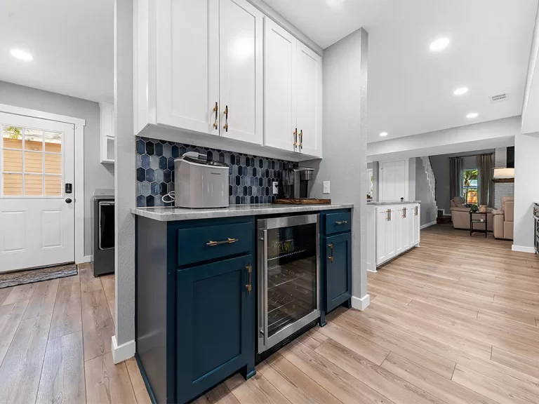 Cedar Knob Whole Home Remodel - Modern kitchen with blue cabinetry.