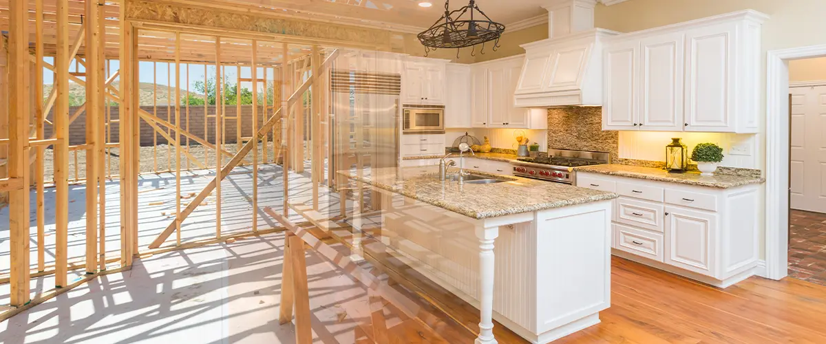 Home remodeling from wood frame construction to a modern white design with granite countertops and high-end finishes.