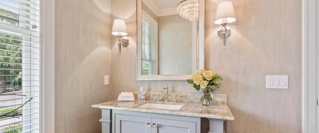 Elegant bathroom vanity with marble countertop and decorative lighting