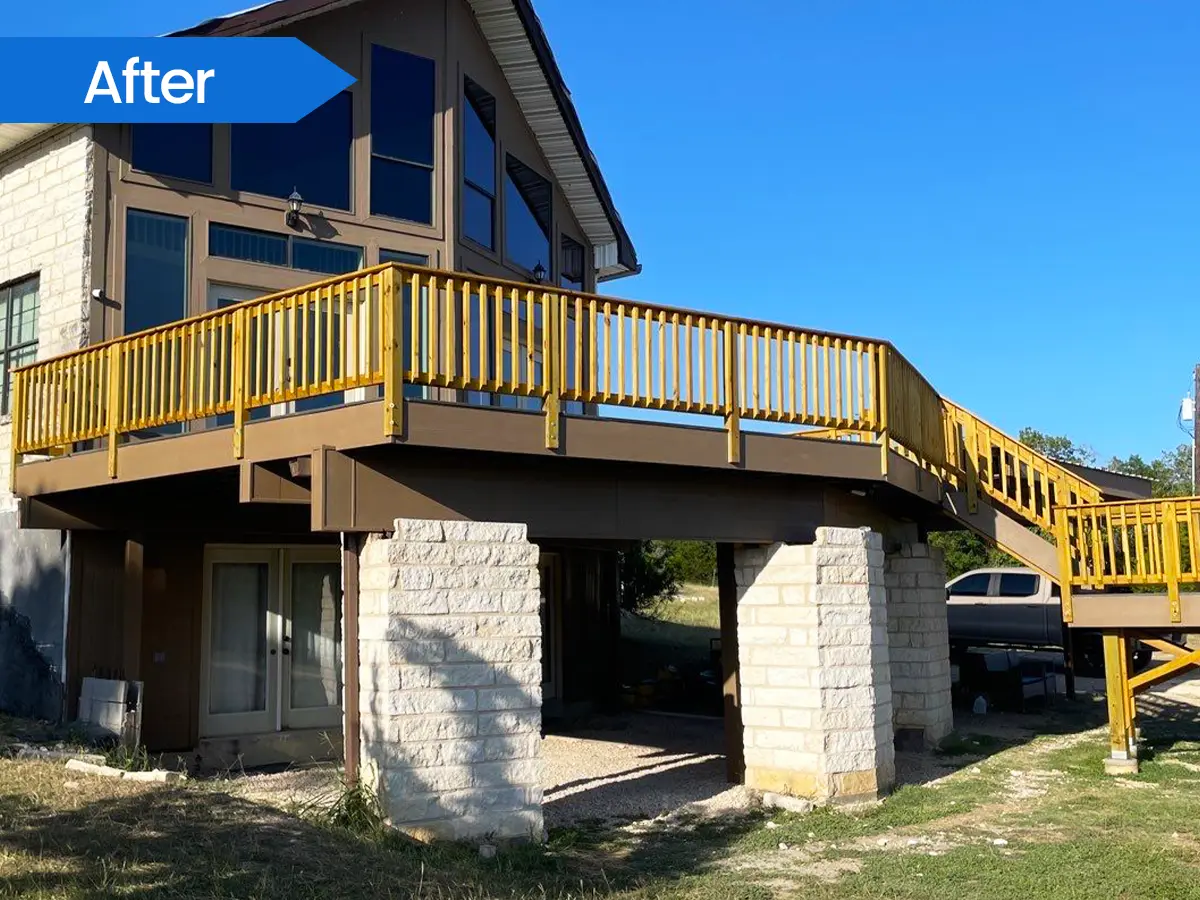 Elevated wooden deck with stone pillars supporting the structure.