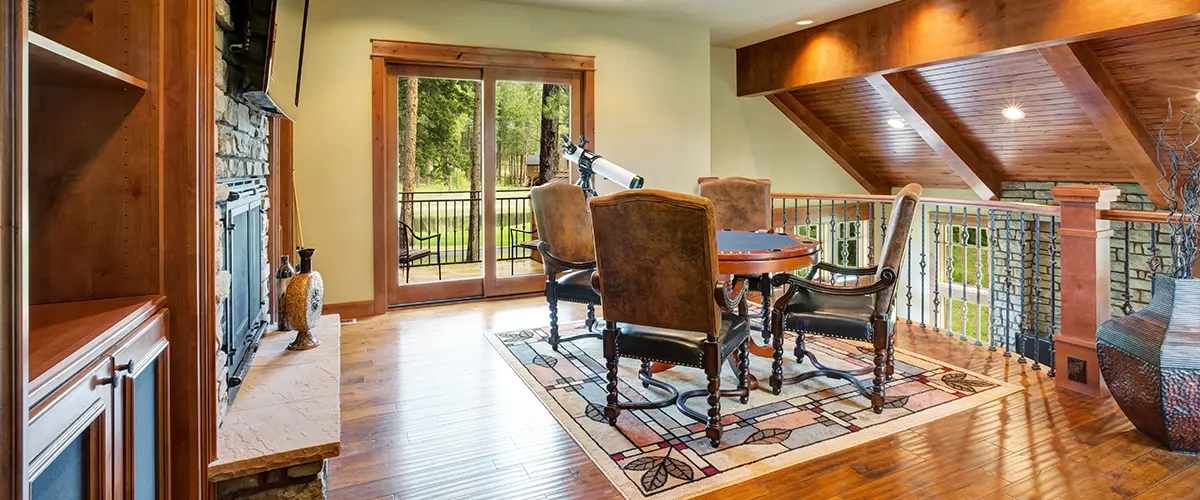 Upstairs game room with wood ceiling and poker table