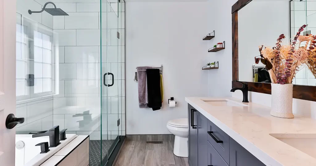 Full bathroom with glass shower and black fixtures