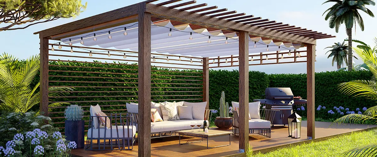 Inviting wooden pergola featuring string lights and a white retractable canopy over a comfortable outdoor seating area on a deck.