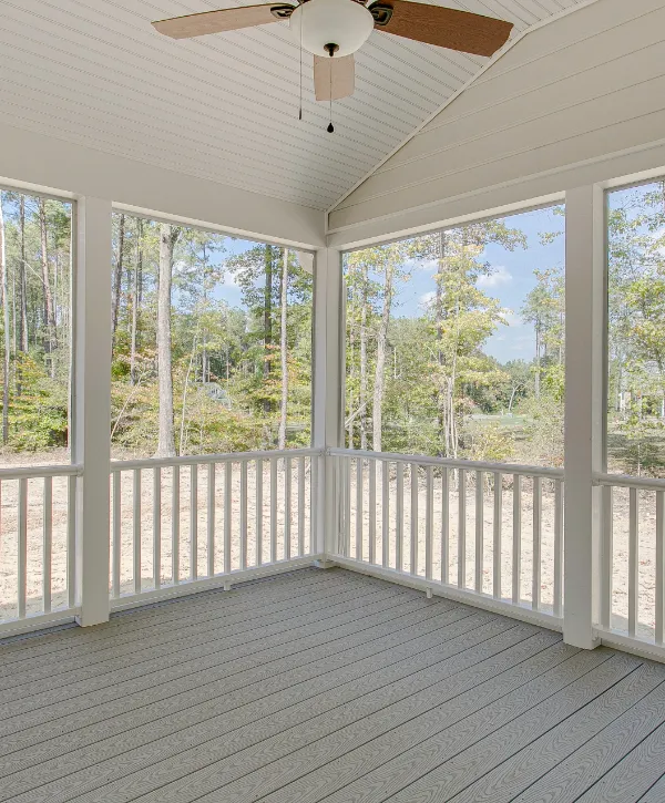 a screened porch featuring a wooden ceiling fan white ceilings and grey deck