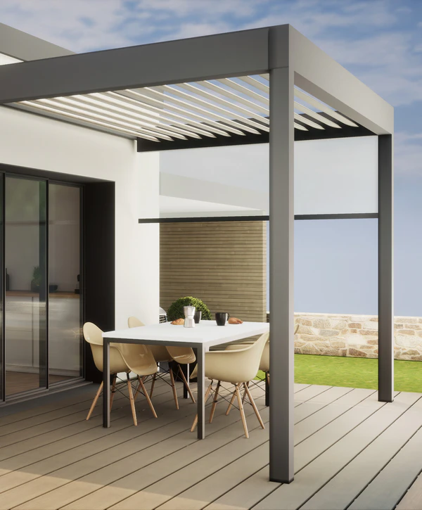 A modern dark grey and white louvered pergola with a retractable side shade installed over a contemporary outdoor dining area by a professional pergola builder in Killeen, TX.