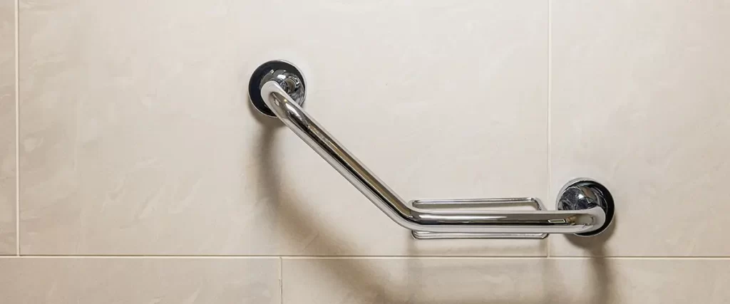 ADA-compliant bathroom grab bar installation on tiled shower wall for safety and accessibility
