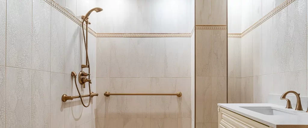 Accessible walk-in shower remodel with grab bars, handheld shower, and custom bathroom vanity