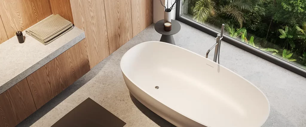 Modern freestanding bathtub with wood vanity and floor-to-ceiling window overlooking tropical greenery