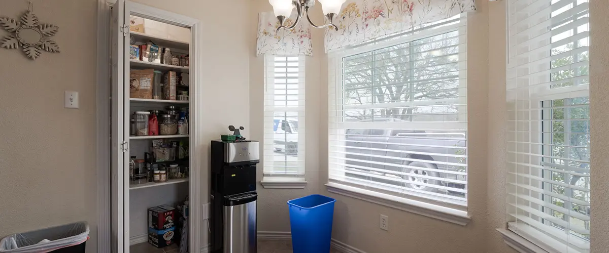 Home addition dining area with pantry storage, large windows and natural light